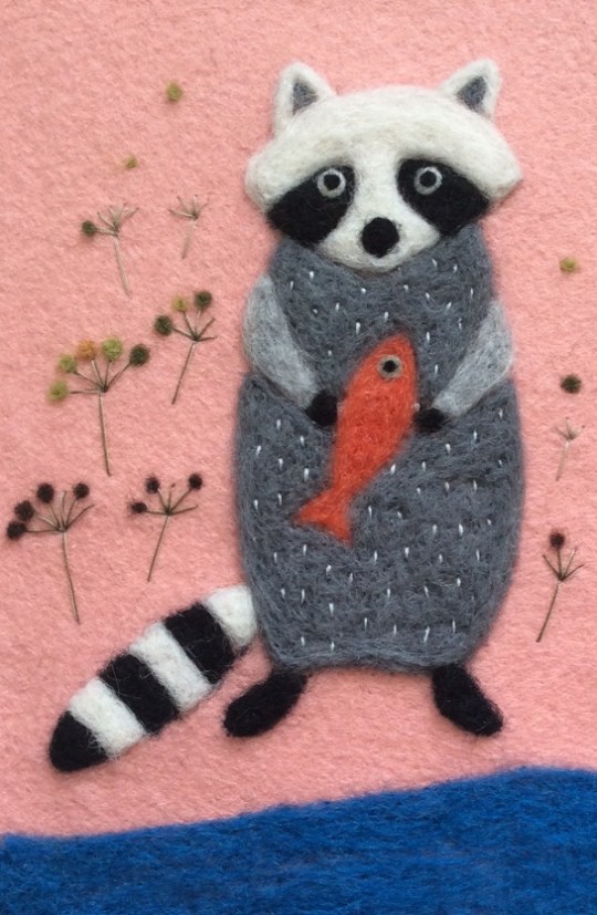 raccoon with fish